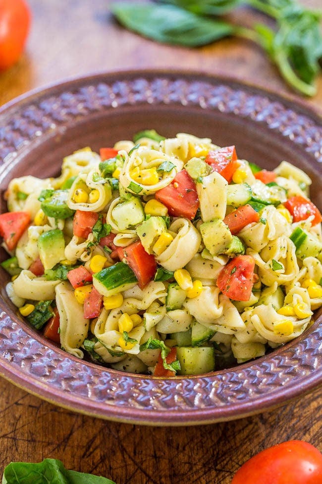 Garden Fresh Tortellini Pasta Salad - Juicy tomatoes, cucumbers and corn with creamy avocado, basil and parmesan tossed in lemon vinaigrette with cheese tortellini!! Healthy, easy, ready in 15 minutes! Garden Fresh Tortellini Pasta Salad - Juicy tomatoes, cucumbers and corn with creamy avocado, basil and parmesan tossed in lemon vinaigrette with cheese tortellini!! Healthy, easy, ready in 15 minutes!