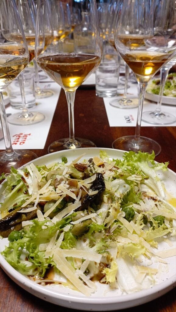 A sea of wine glasses and the delicious fava bean dish, with grated cacciocavalo cheese on top A sea of wine glasses and the delicious fava bean dish, with grated cacciocavalo cheese on top