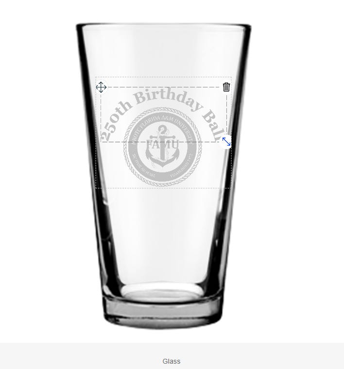 A clear pint glass on a white background shown in a product editor. A dashed, resizable overlay on the front displays a faint circular emblem with an anchor and the letters “FAFU,” surrounded by small text referencing Florida A&M University, with curved text reading “250th Birthday Ball.” Move, resize, and delete icons appear around the overlay. A caption below reads “Glass.”