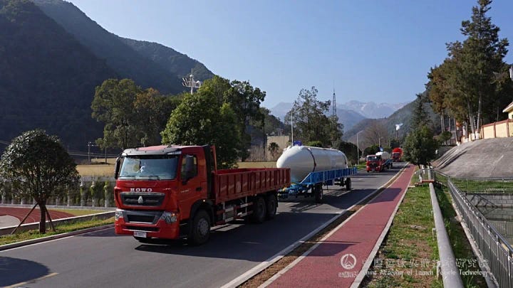The boosters arriving at the launch pad, the second-stage being lifted during stacking, engineers preparing the rocket for launch, and ChinaSat-10R being lifted into integration facilities.