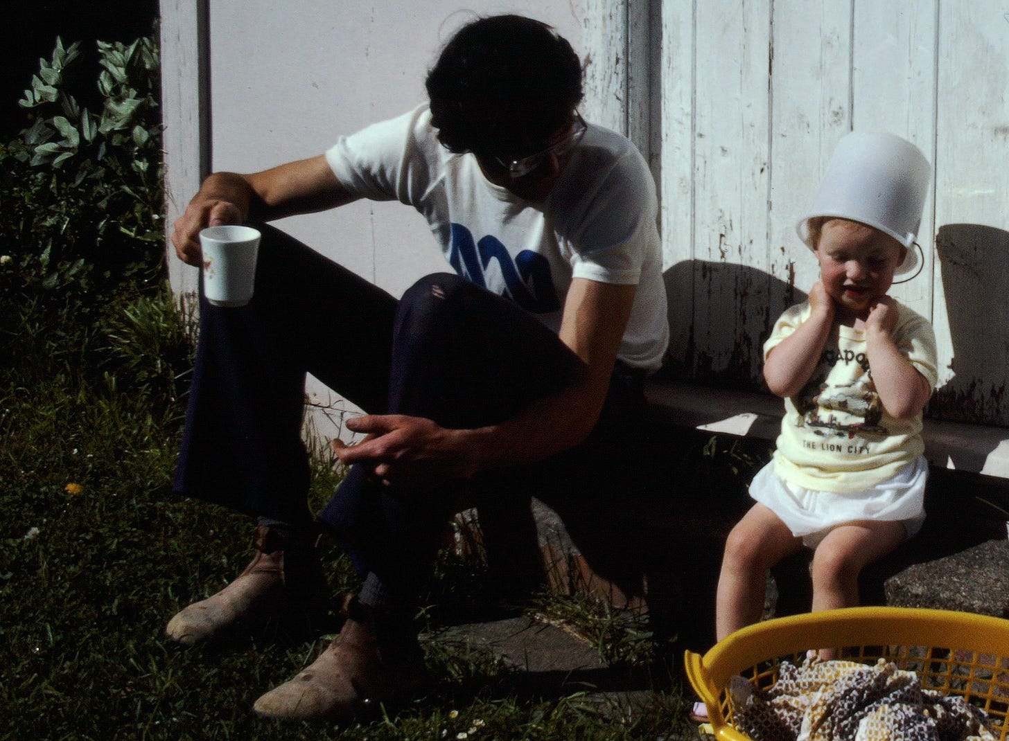 The author listening to dad (with a bucket on her head)