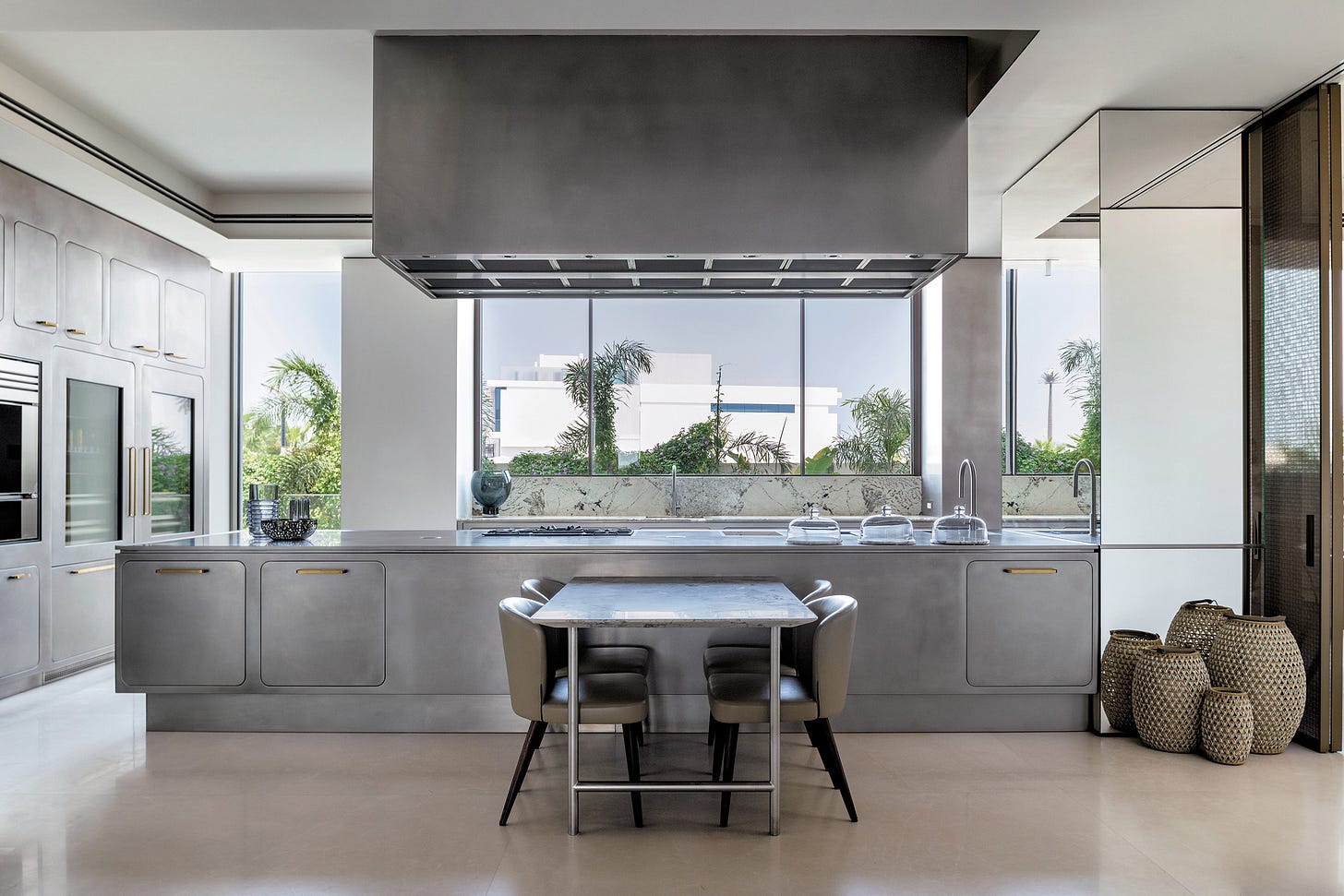 Contemporary stainless steel kitchen cabinetry featuring minimalist design with brushed finishes Contemporary stainless steel kitchen cabinetry featuring minimalist design with brushed finishes