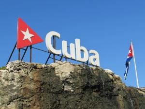 Photo by STOUTfilmsHavana - cuba signage on top of a rock