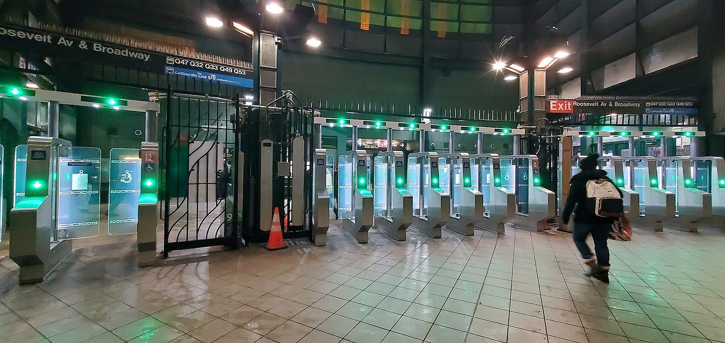 Clear-panel fare gates at Jackson Heights–Roosevelt Avenue station. Clear-panel fare gates at Jackson Heights–Roosevelt Avenue station.