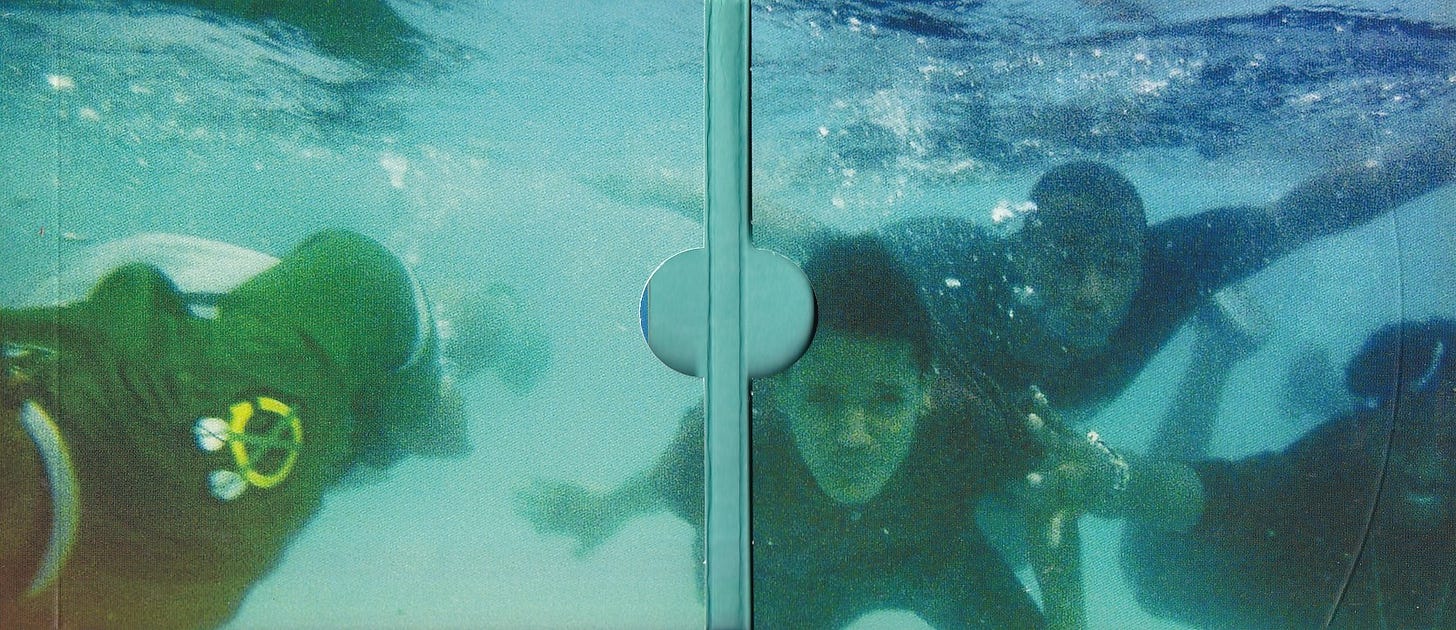 the gatefold image for The Internet's Feel Good CD, featuring the band members posing underwater