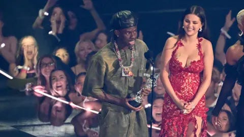 Reuters Nigerian singer Rema and US singer and actress Selena Gomez 