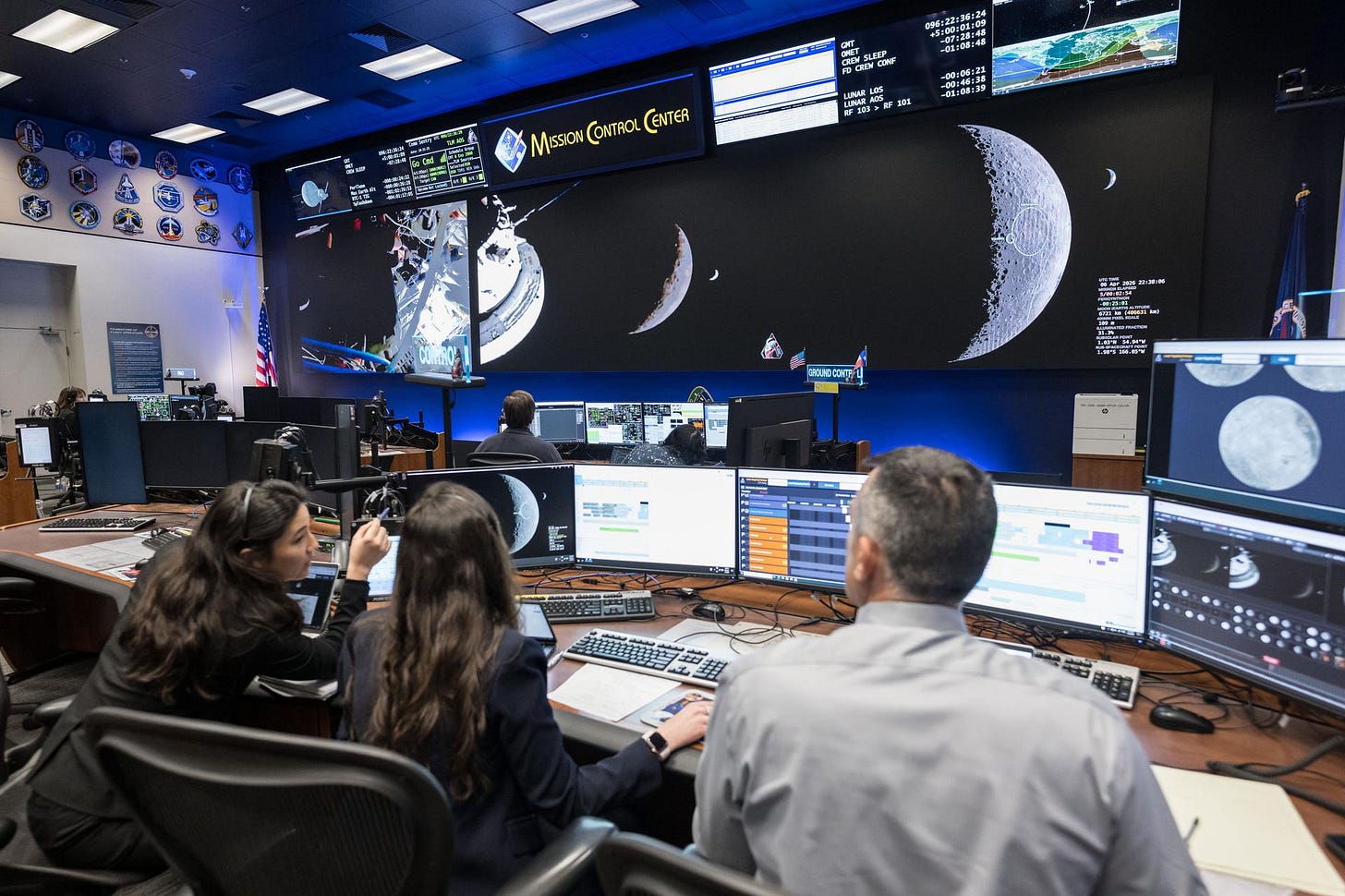 Pictured from left to right, Angela Garcia, Dr. Kelsey Young, and Dr. Trevor Graff, the first science officers of the Artemis program in the White Flight Control Room in the Christopher C. Kraft Jr. Mission Control Center at NASA’s Johnson Space Center. Seen here about ten minutes before Earthset during Artemis II, these science officers are seen monitoring mission data in real-time from the Science console. They support flight controllers by analyzing scientific measurements and system performance. Their work helps ensure mission objectives are achieved safely and efficiently.