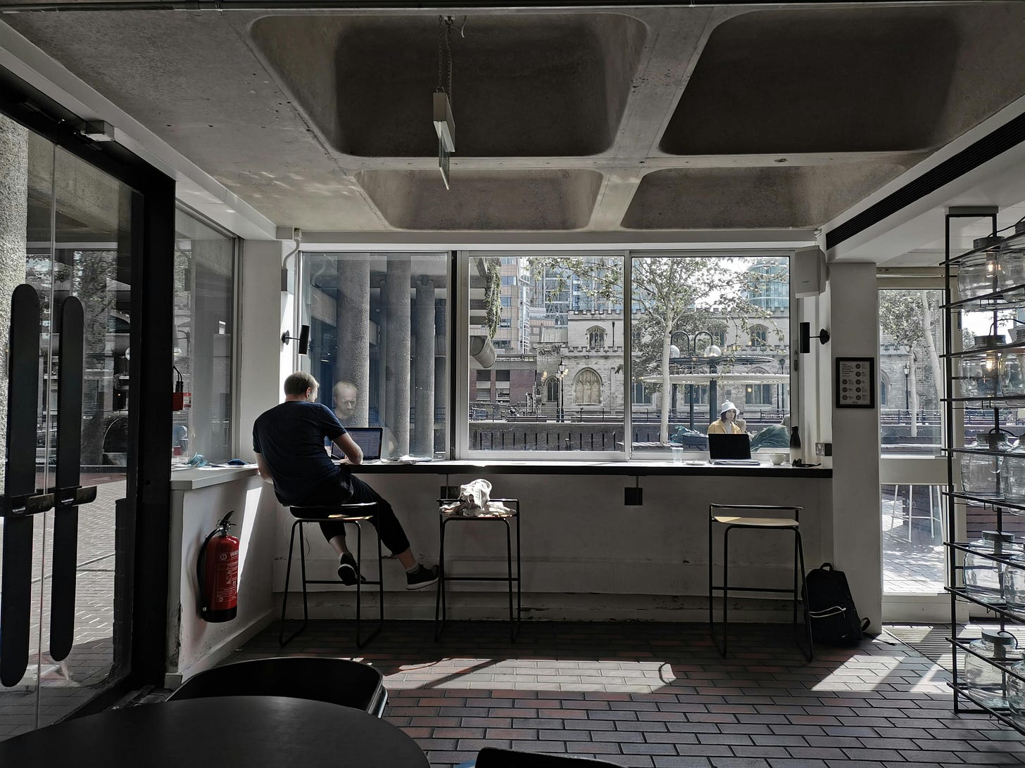 Photograph of a Man Working in a Coffee Shop by Elena Franklin