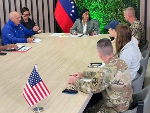 Interior Minister Diosdado Cabello (in blue) sits beside acting President Delcy Eloína Rodríguez as she discusses disaster aid efforts with US military and government representatives in Caracas. (from Venezuelan Minister for Habitat and Housing Paola Posani via Instagram)