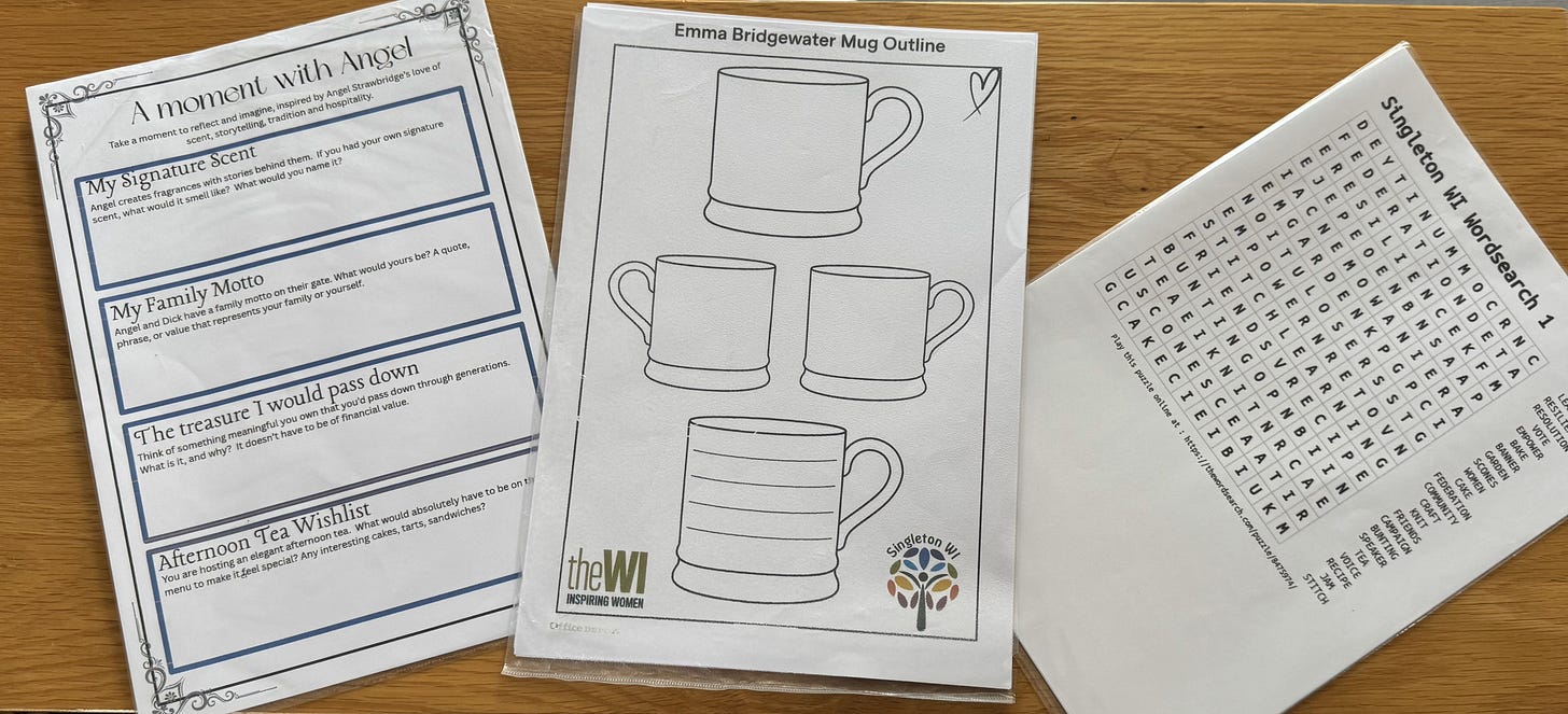 Three sheets on a wooden table: a writing prompt page with lines for personal reflections, a mug outline for creative design, and a word search puzzle.