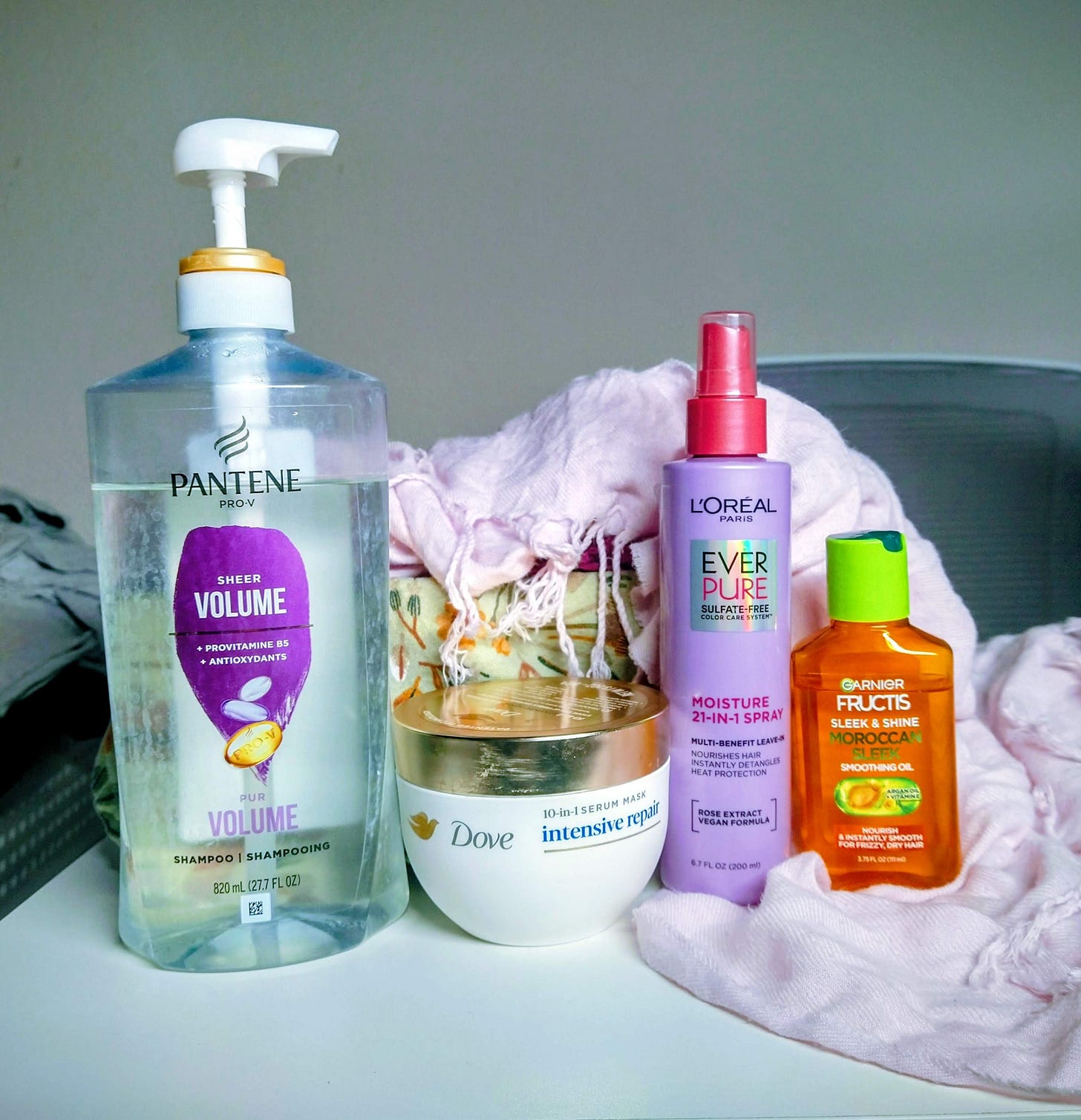 Photo of Pantene Sheer Volume shampoo, Dove Intensive Repair Hair Mask, L'Oreal 21-in-1 Leave-in Conditioning Spray, and Garnier Fructis Sleek and Shine hair oil