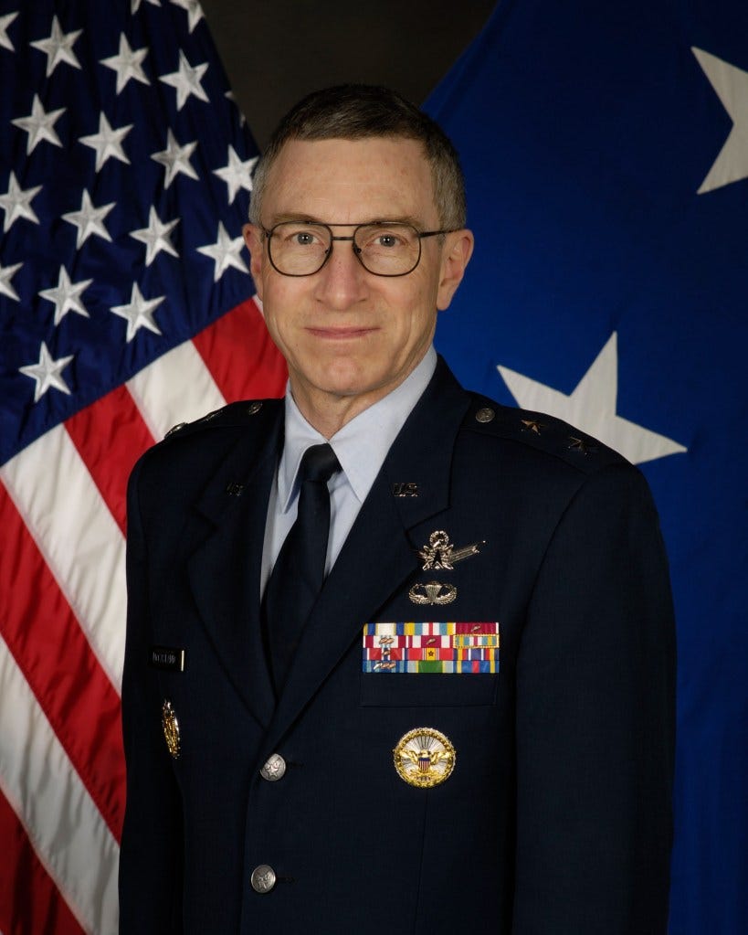 Official portrait of U.S. Air Force General William McCasland in uniform with the American flag behind him. Official portrait of U.S. Air Force General William McCasland in uniform with the American flag behind him.