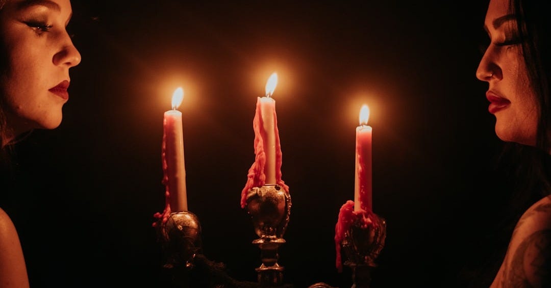 a woman and a man holding candles a woman and a man holding candles