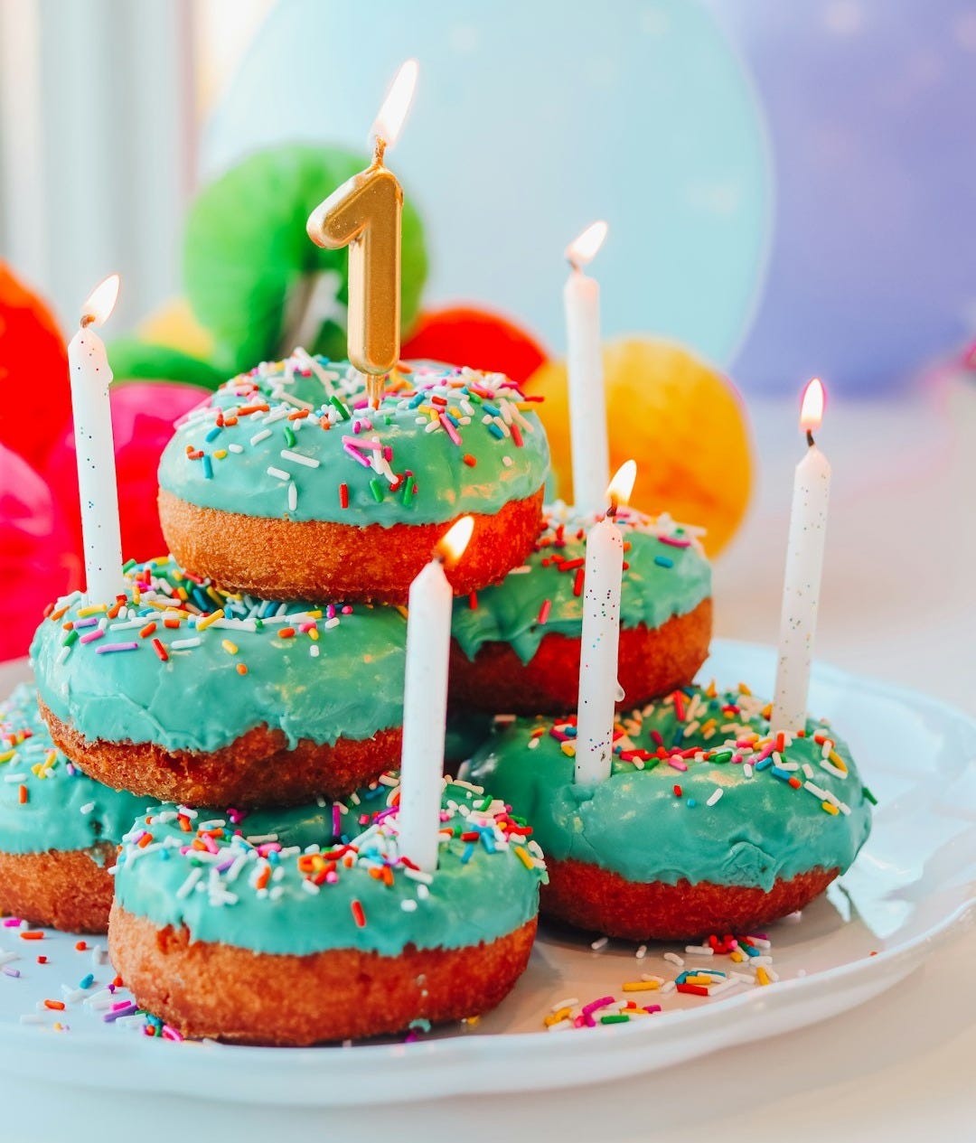 pink and brown cake with candles
