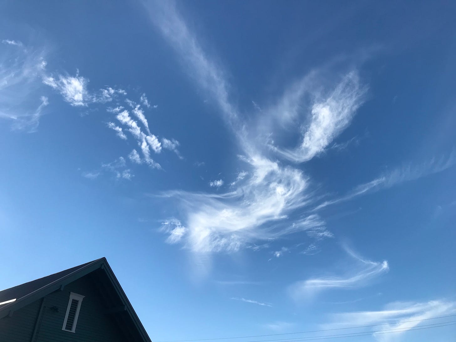 Blue sky, white cloud, dark roof, kissing freedom