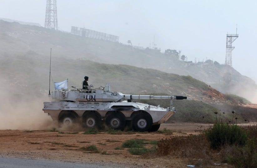 A UNIFIL peacekeeper rides on an armored vehicle in Naqoura, near the border with Israel, in southern Lebanon, on August 31, the day of the UN Security Council’s decision to extend the force’s mandate. (photo credit: AZIZ TAHER/REUTERS) A UNIFIL peacekeeper rides on an armored vehicle in Naqoura, near the border with Israel, in southern Lebanon, on August 31, the day of the UN Security Council’s decision to extend the force’s mandate. (photo credit: AZIZ TAHER/REUTERS)