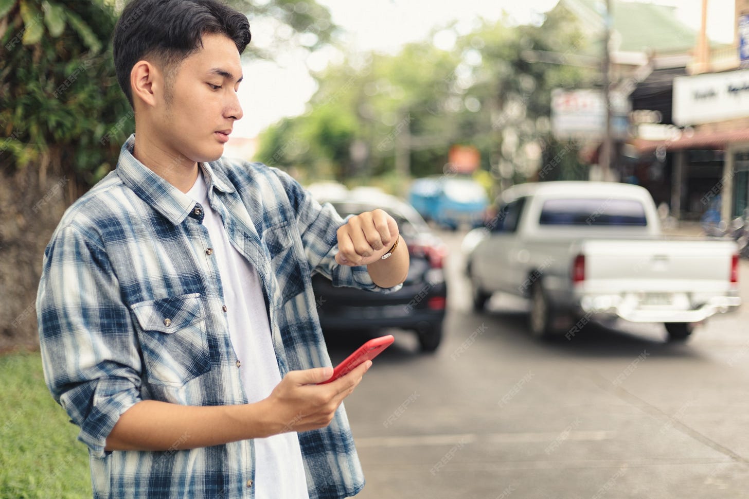 Premium Photo | Asian man waiting for uber taxi