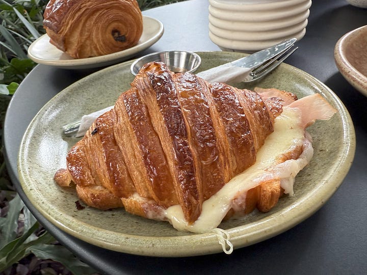 Mercado 100 goods, kombucha, Vulevú croissant sandwich, pastries