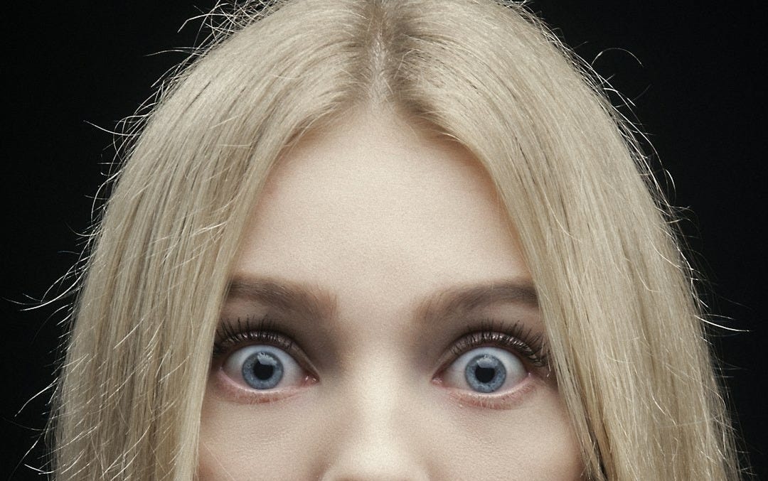 woman with blonde hair and red lipstick