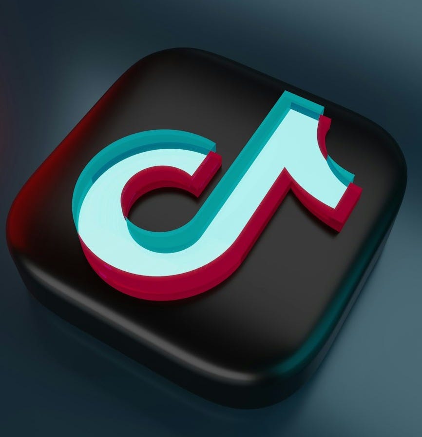 a black and red square button with the letter c on it a black and red square button with the letter c on it