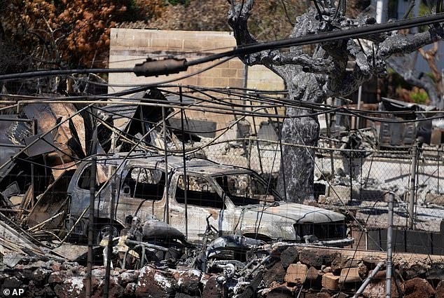 Destroyed property is seen in charred ruins, Sunday, August 13, 2023, in Lahaina, Hawaii, following the deadly wildfire