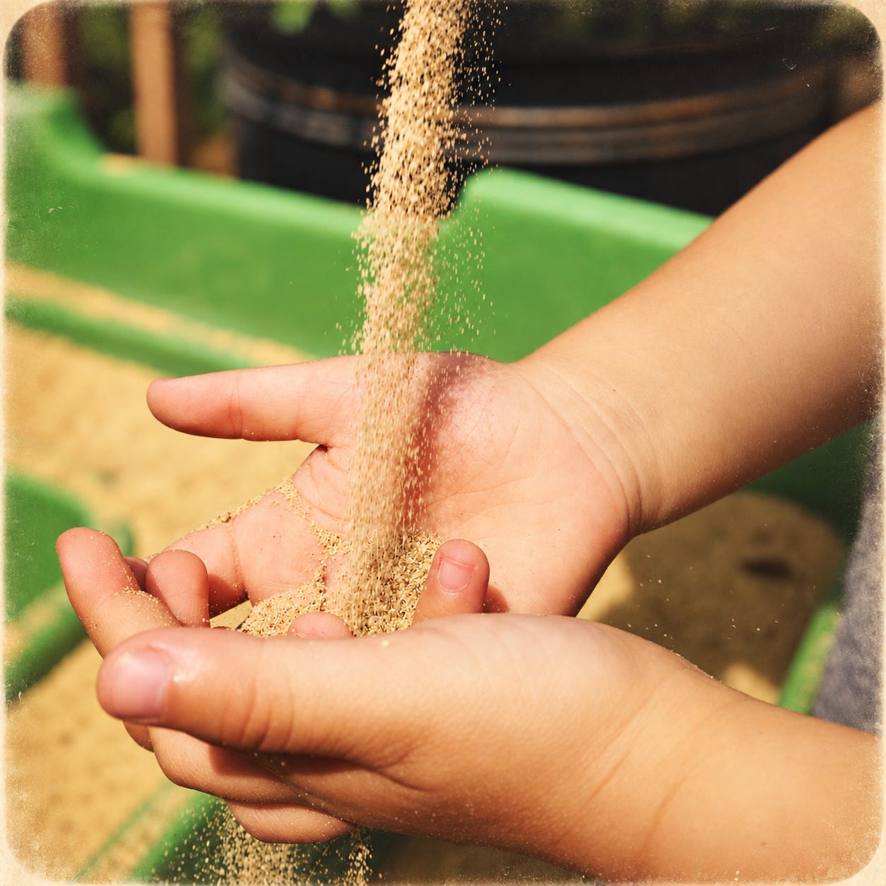 Sand passing through open hands Sand passing through open hands
