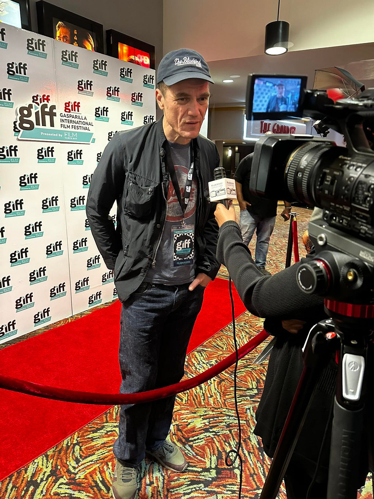 May be an image of 2 people, television and text