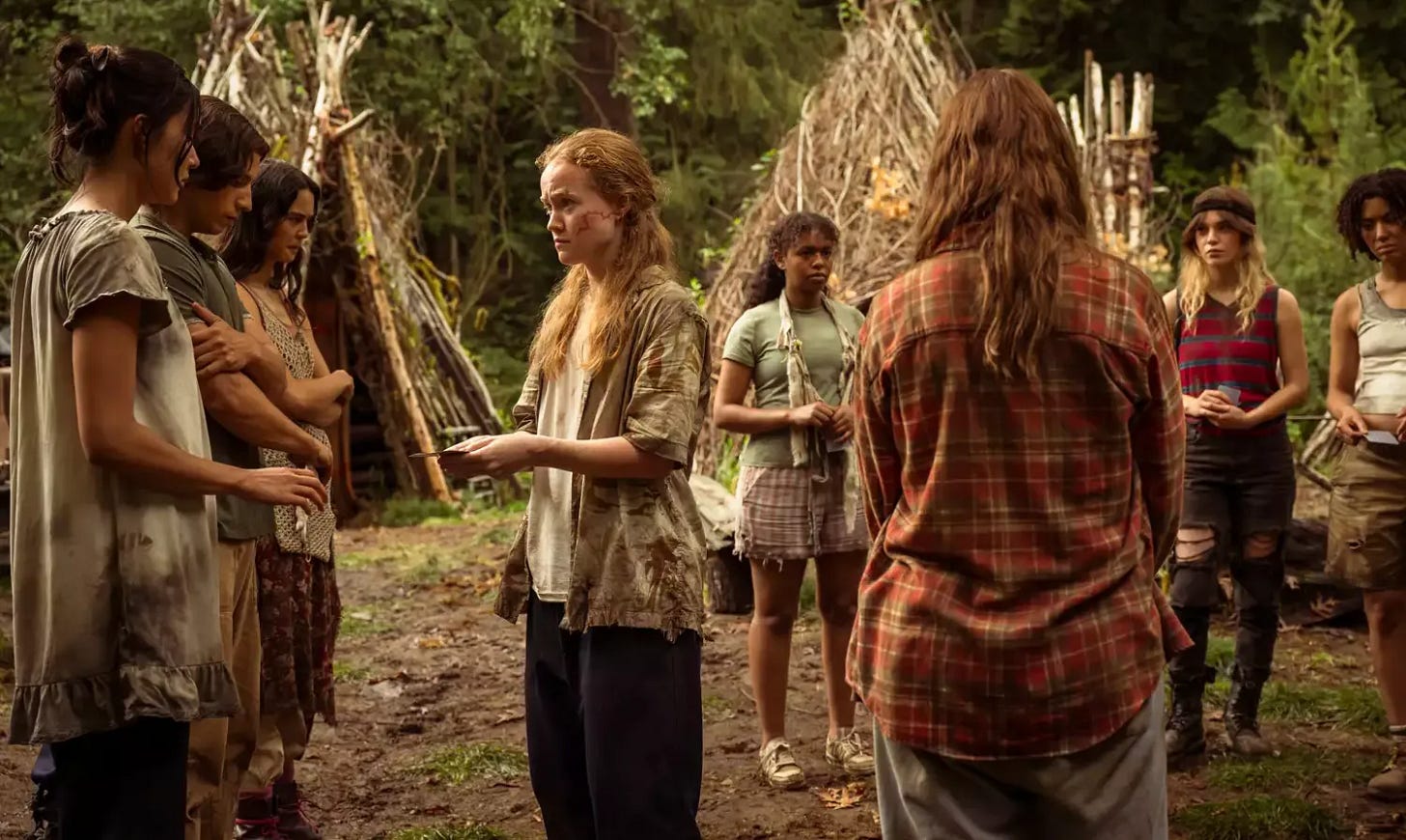 L-R: Alexa Barajas as Teen Mari, Kevin Alves as Teen Travis, Courtney Eaton as Teen Lottie, Liv Hewson as Teen Van, Silvana Estifanos as Teen Britt, Sophie Thatcher as Teen Natalie and Jasmin Savoy Brown as Teen Taissa in Yellowjackets