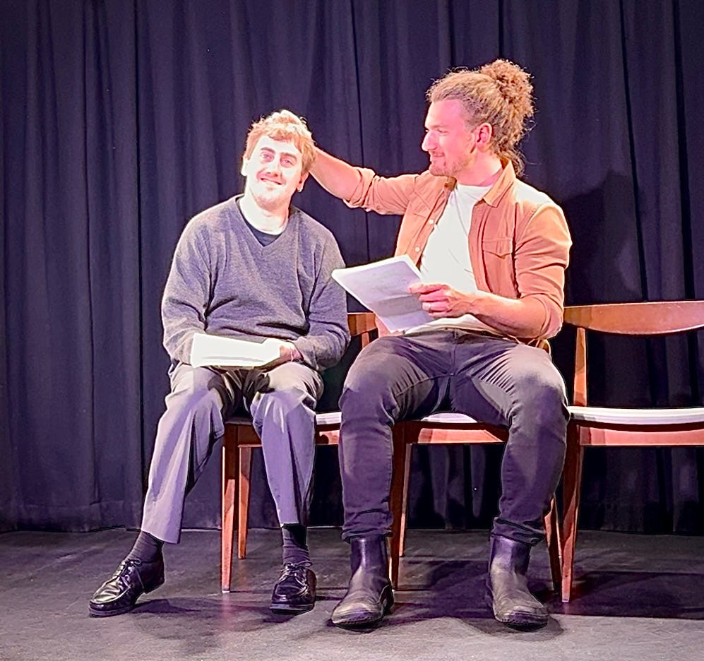 Tom Zachar tousles Alex McCaragher's hair while performing "The Cat, Sage" onstage for Page to Stage London. A short script by Owen Schaefer.