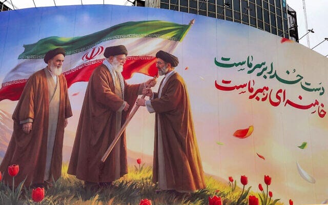 A banner is displayed at Valiasr Square in central Tehran on March 10, 2026, depicting Iran's late supreme leader Ayatollah Ruhollah Khomeini (left) watching as his successor the late Ayatollah Ali Khamenei (center) hands over an Islamic Republic of Iran flag to his son and new supreme leader Mojtaba Khamenei (right). (AFP)