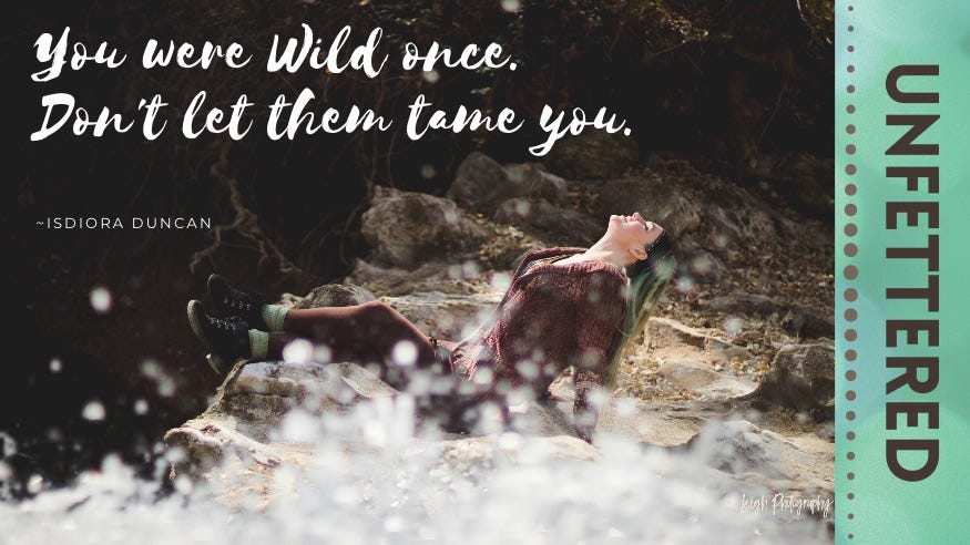 Unfettered: You were wild once. Don't let them tame you. Isadora Duncan. The green-haired author arches back with her eyes closed and head tilted toward the sun while basking on the rocks atop a waterfall. In the foreground, the water crashes. Unfettered: You were wild once. Don't let them tame you. Isadora Duncan. The green-haired author arches back with her eyes closed and head tilted toward the sun while basking on the rocks atop a waterfall. In the foreground, the water crashes.