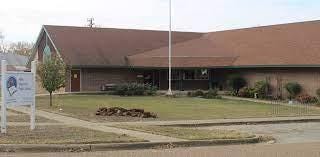 A picture containing text, outdoor, grass, building

Description automatically generated