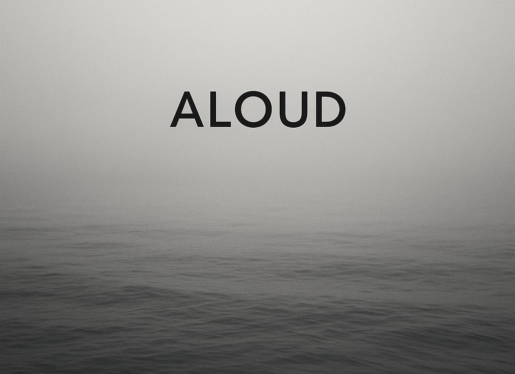 The word 'Aloud" printed across a still ocean overalid with fog, in black & white