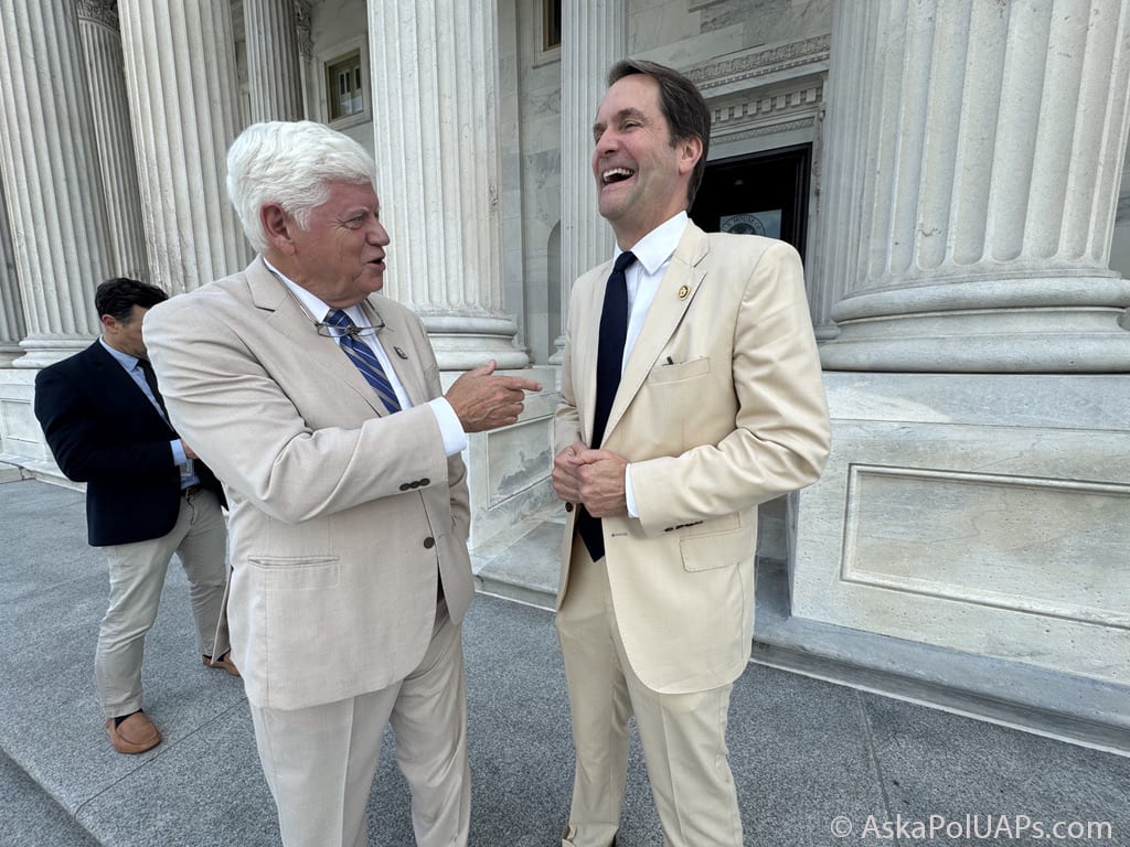 Two white men in tan summer suits laugh outside building with greek columns © Ask a Pol UAPs