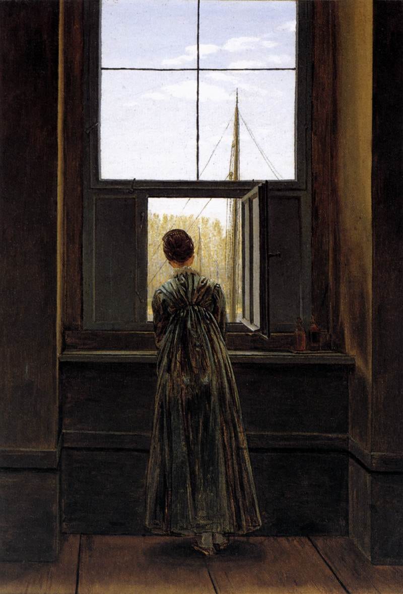 Woman seen from behind window Woman seen from behind window