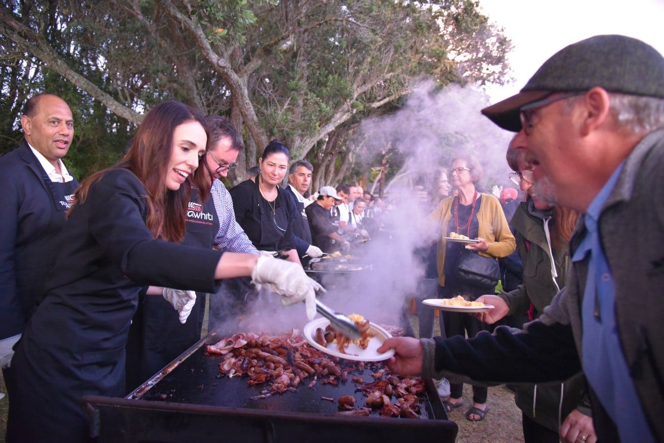 Jacinda Ardern and members of her government served Kiwis a free barbecue breakfast at Waitangi on New Zealand's national day in February 2021.
