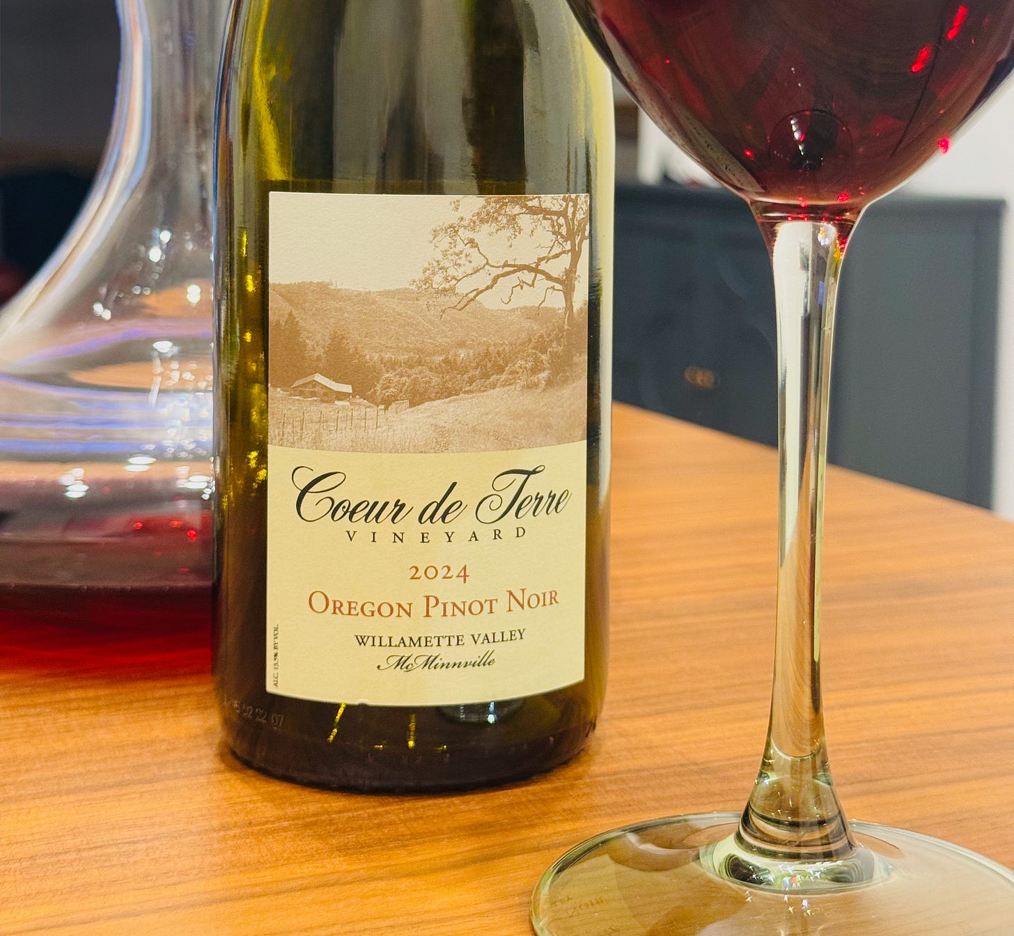 A bottle of wine from Oregon's Willamette Valley - Coeur de Terre, glass and decanter ready to pour. A bottle of wine from Oregon's Willamette Valley - Coeur de Terre, glass and decanter ready to pour.