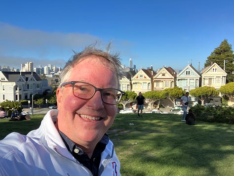 Photos of river rapids along the rocks, clouds over the forest and ocean inlet, roses and trees, man wearing glasses in San Francisco, man wearing bike helmet and sunglasses on Angel Island