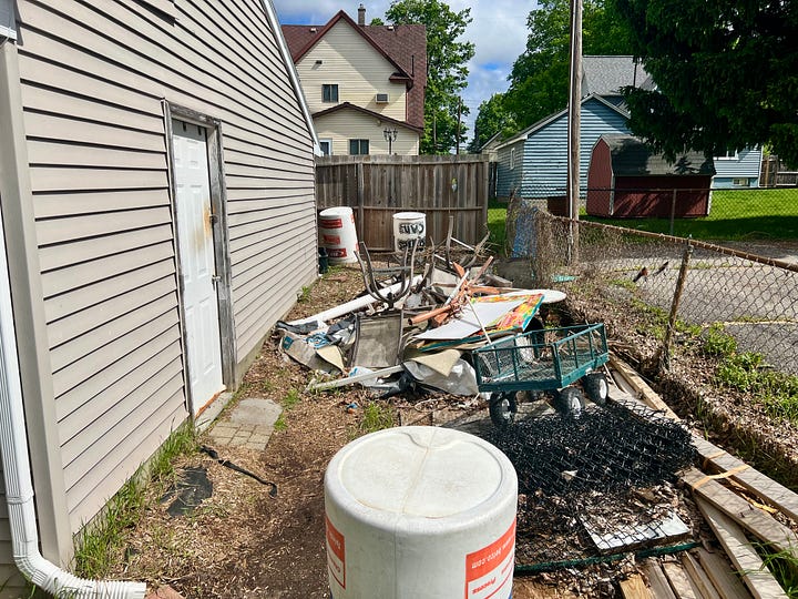 The Million Dollar Garage stands at the ready...a pile of purged trash ready to be removed...a semi studio set up outside ready to be used until the rebuild begins...the garden ready to be planted...and the patio ready to be used in the way patios are used during the Michgan summer