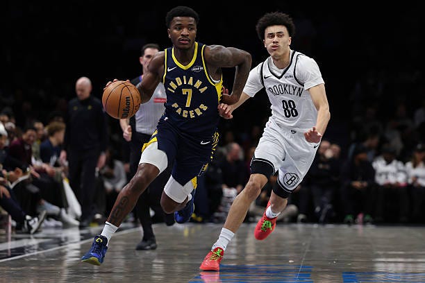 Kam Jones of the Indiana Pacers dribbles the ball past Nolan Traore of the Brooklyn Nets during the first quarter at Barclays Center on February 11,... Kam Jones of the Indiana Pacers dribbles the ball past Nolan Traore of the Brooklyn Nets during the first quarter at Barclays Center on February 11,...