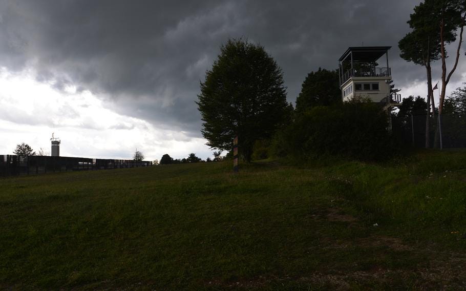 The East German observation tower, seen in the distance at left, and the American tower, on the right, stand almost face to face across what was once the inner-German border during the Cold War. Today, both are part of the Point Alpha Memorial.





