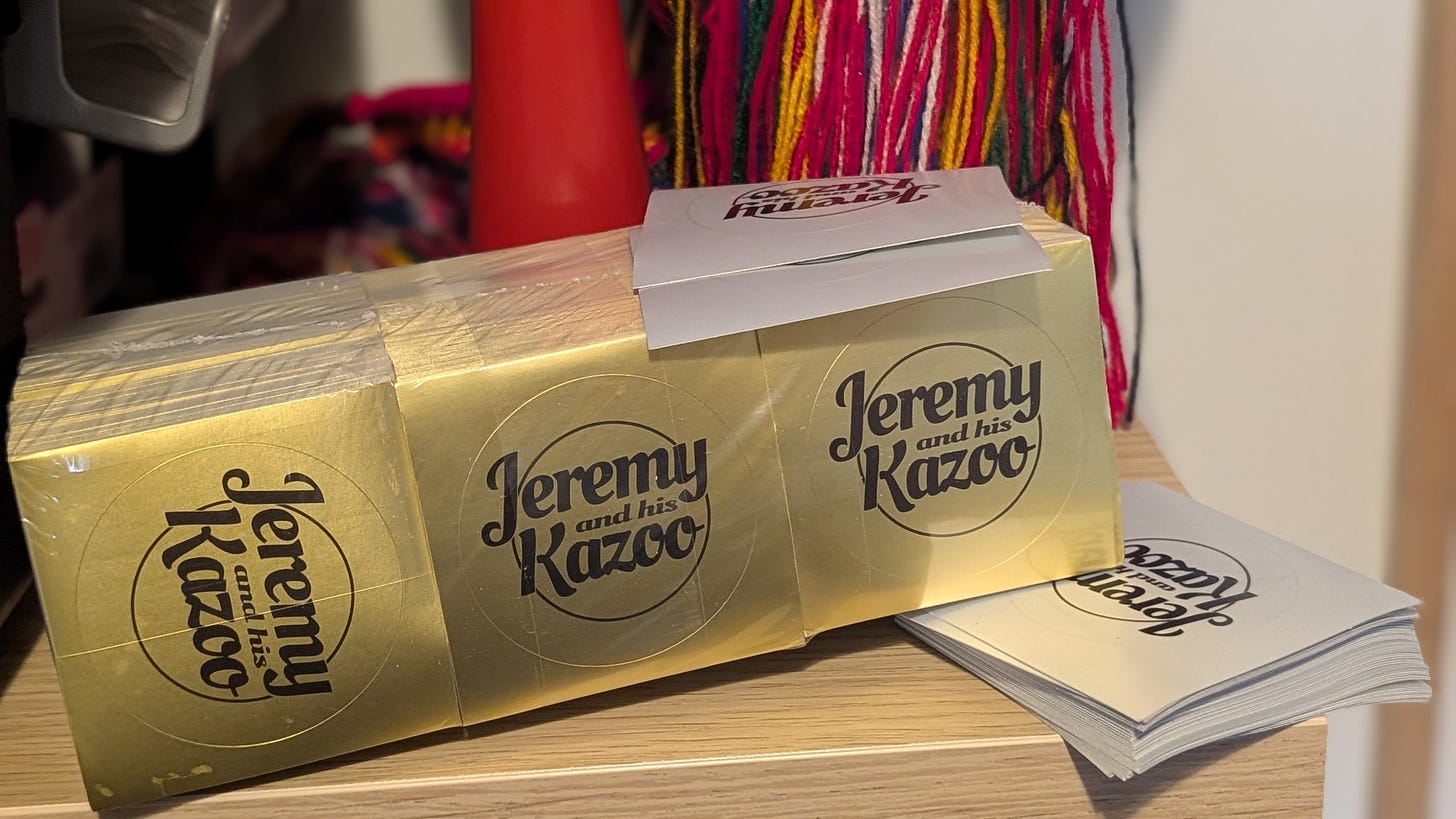 A package of gold stickers labelled "Jeremy and his Kazoo"
