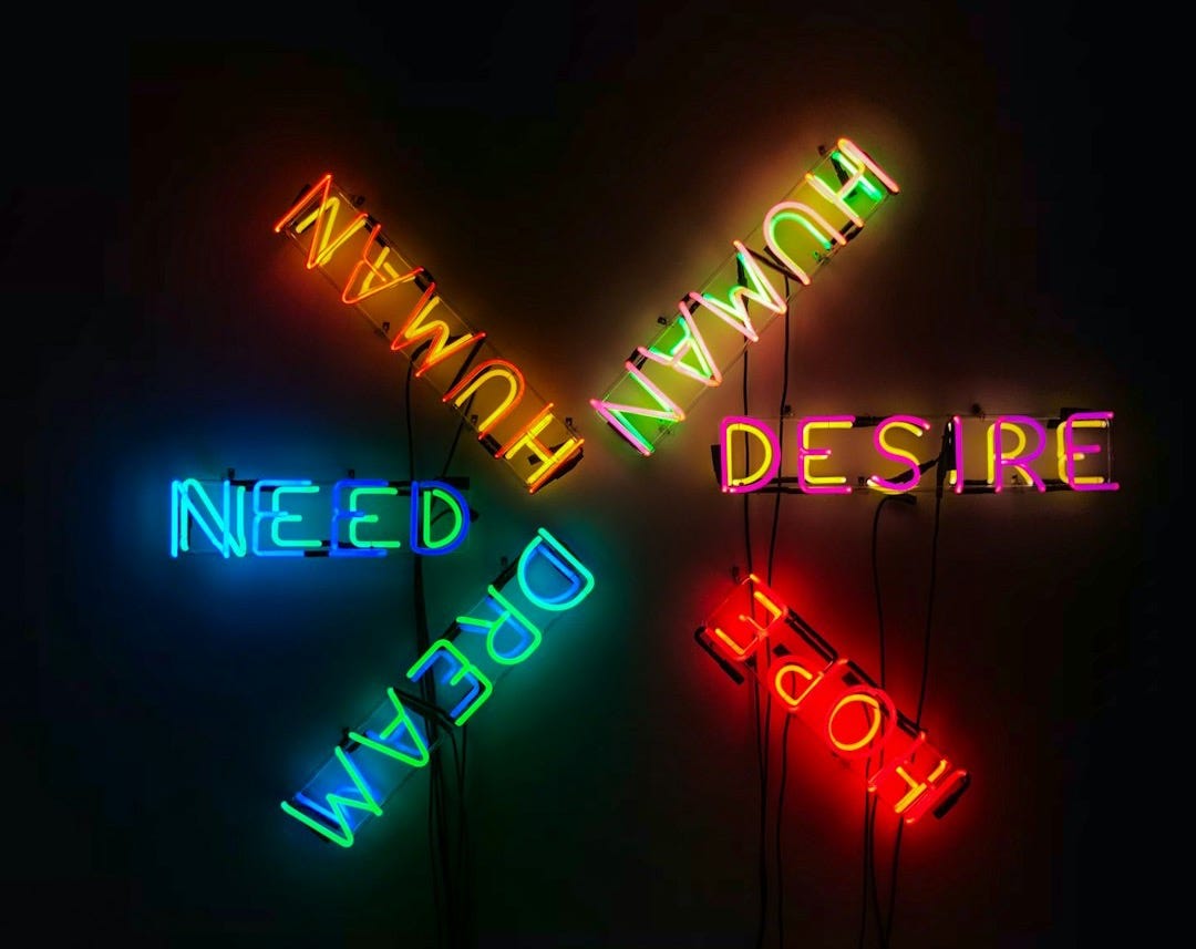 Human, Desire, Hope, Need, and Dream neon light signage Human, Desire, Hope, Need, and Dream neon light signage