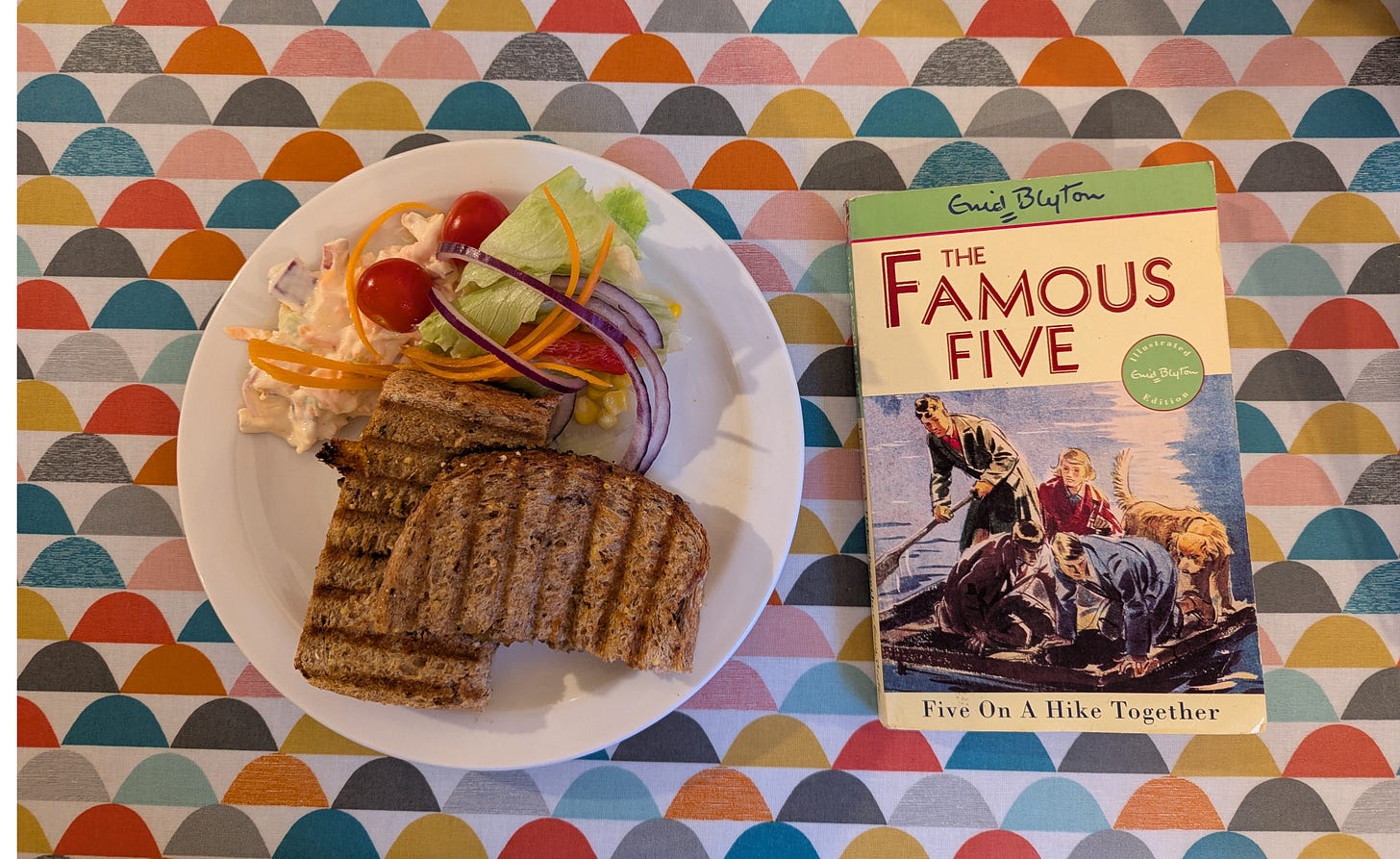 patterned tabletop with toastie and book