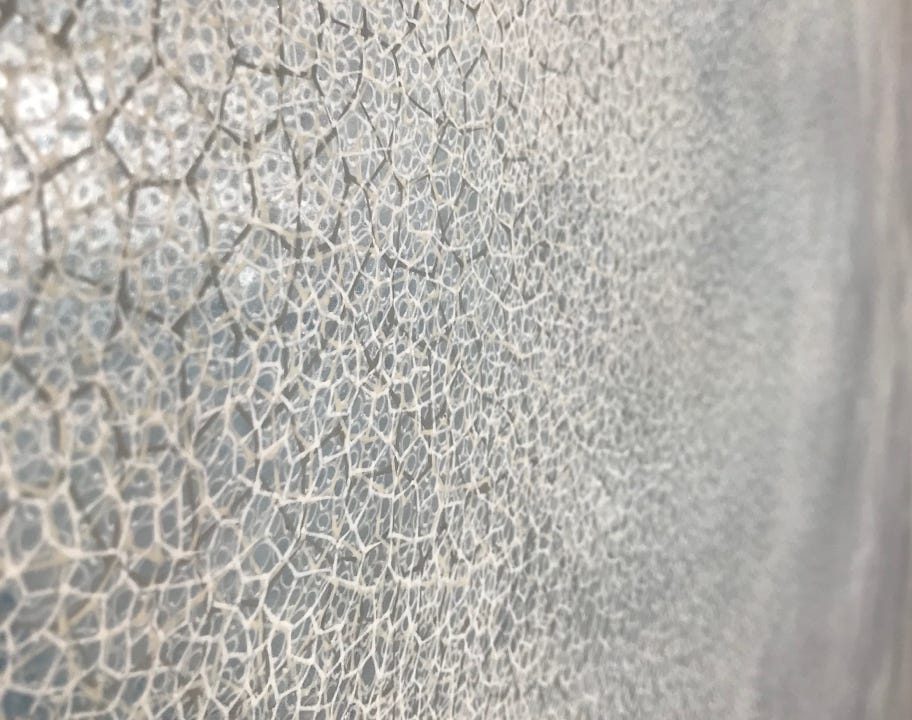 A close up of a grey surface

AI-generated content may be incorrect.