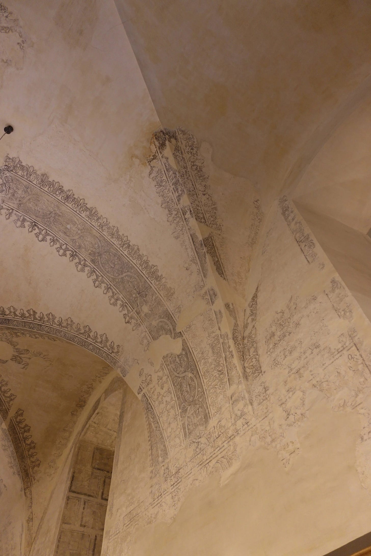  Faded frescos on the walls of La Chaise-Dieu, Auvergne, France 