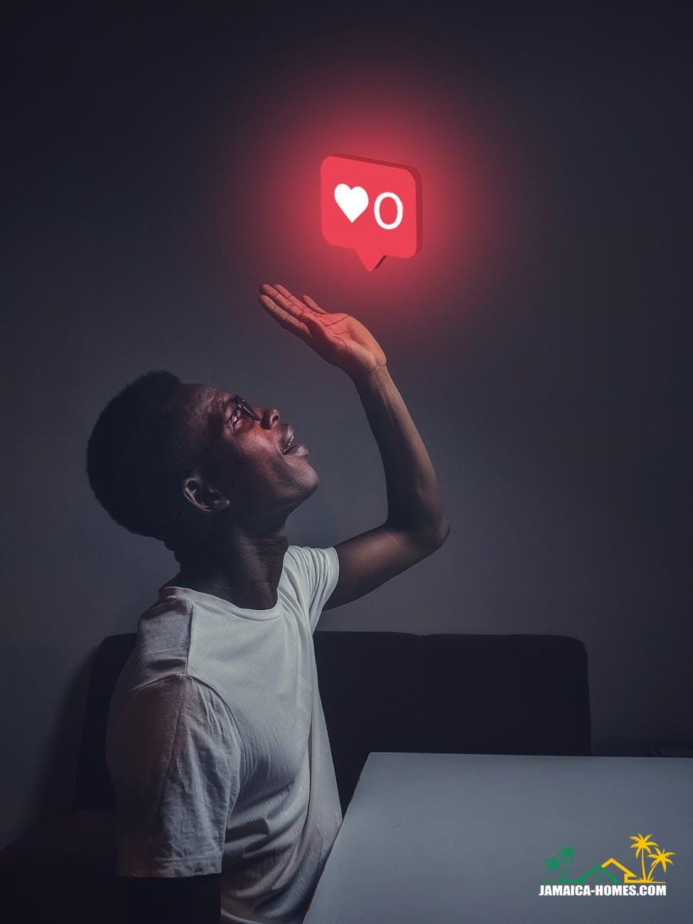 man in white crew neck top reaching for the like