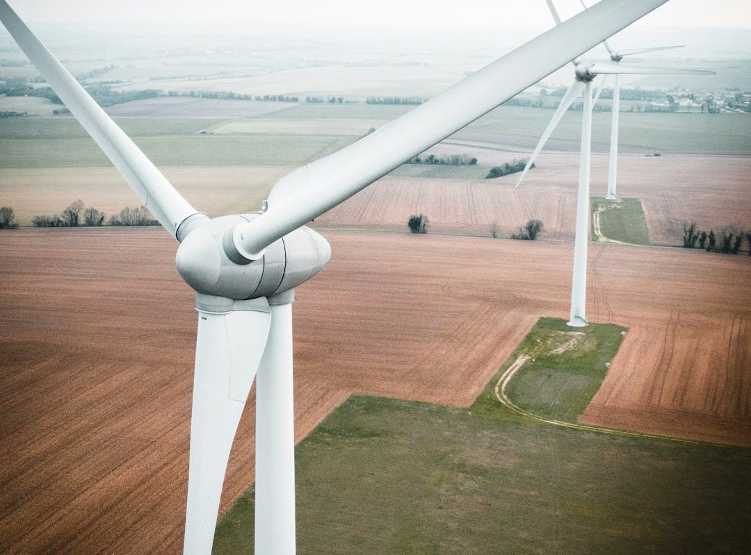 three white windmill during daytime