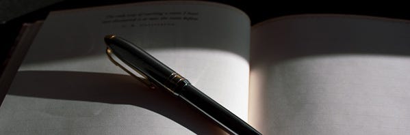 A pen on a book

Description automatically generated with low confidence
