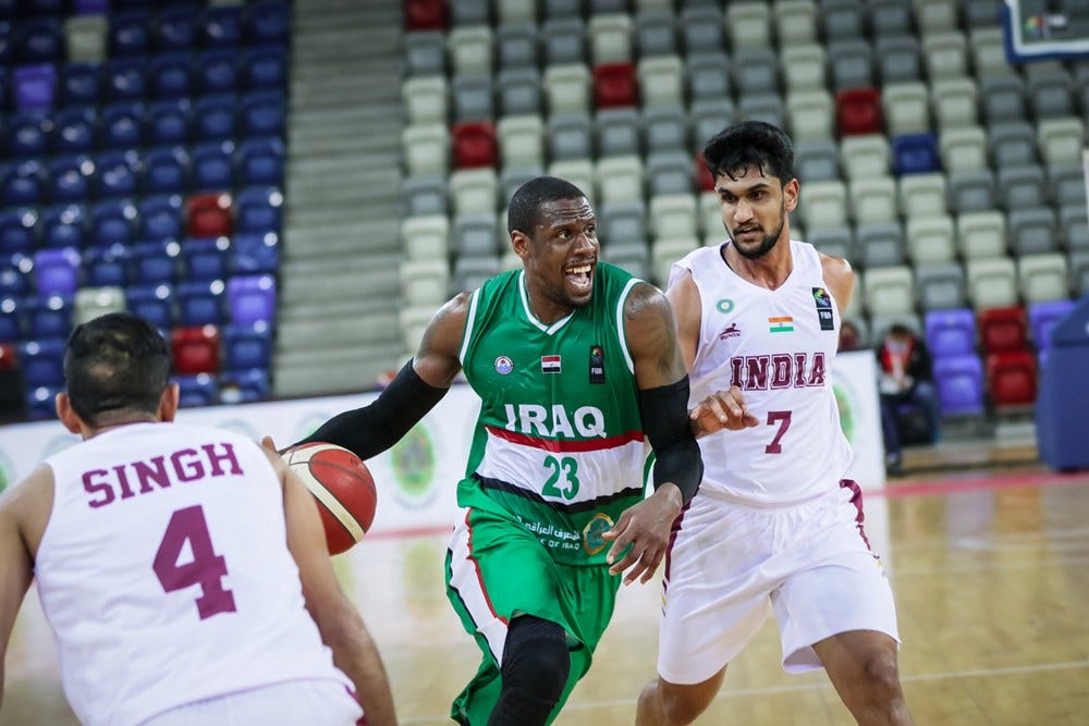 Muin Bek Hafeez guarding Iraq's Kevin Galloway Muin Bek Hafeez guarding Iraq's Kevin Galloway